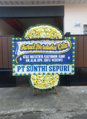 Papan Bunga Duka di Gudang